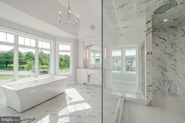 full bathroom featuring a soaking tub, marble finish floor, vaulted ceiling, vanity, and a notable chandelier