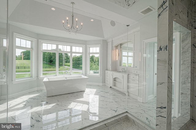 full bathroom with visible vents, marble finish floor, a freestanding bath, vanity, and a notable chandelier