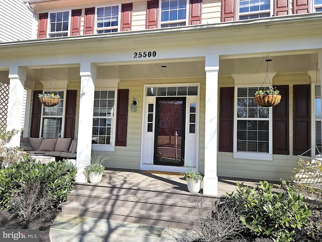 doorway to property with a porch