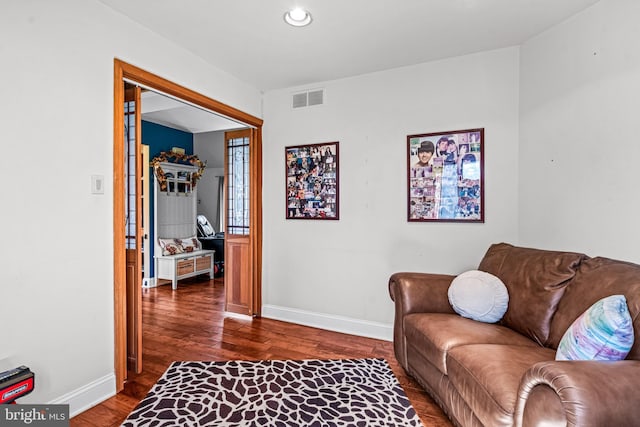 sitting room featuring recessed lighting, visible vents, baseboards, and dark wood-style floors