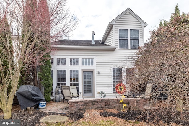 rear view of house with a patio