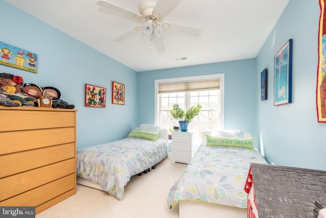 bedroom featuring carpet flooring, ceiling fan, and visible vents