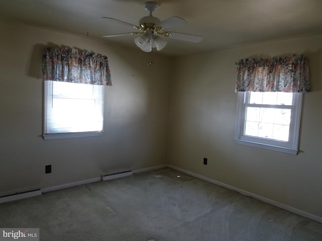 carpeted empty room featuring baseboards, baseboard heating, and a ceiling fan