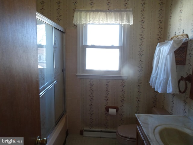 bathroom with toilet, wallpapered walls, vanity, and a baseboard radiator