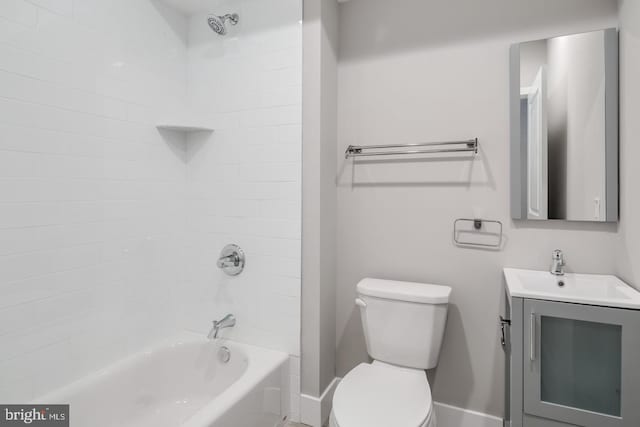 bathroom with toilet, shower / tub combination, baseboards, and vanity