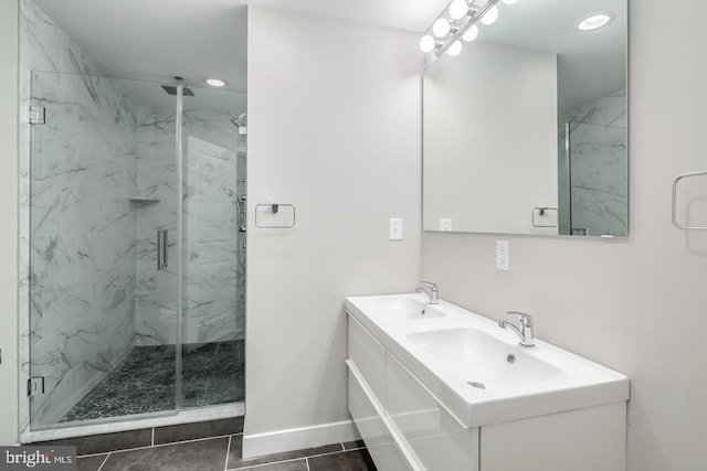 full bathroom with recessed lighting, baseboards, a sink, and a marble finish shower