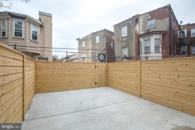 view of patio featuring fence