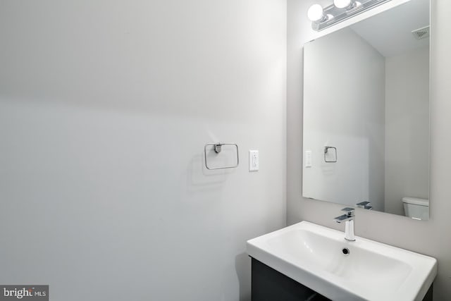 bathroom featuring visible vents and vanity