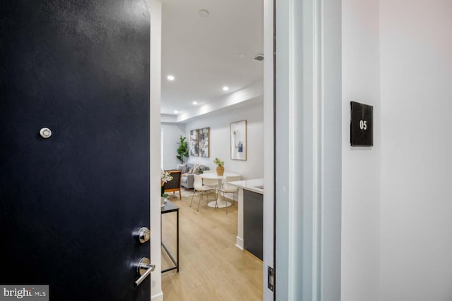 hall featuring recessed lighting and light wood finished floors