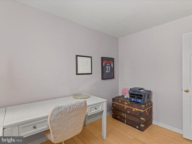 office area featuring baseboards and light wood-style floors