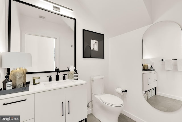 1500 Harry Thomas Way NE Unit 501, Washington, DC 20002 - bathroom featuring visible vents, baseboards, toilet, vaulted ceiling, and vanity