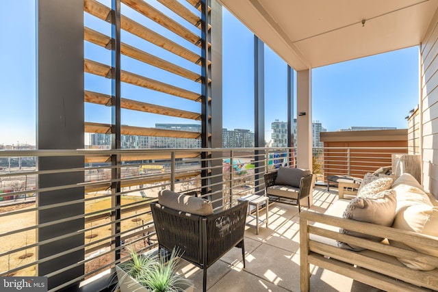 1500 Harry Thomas Way NE Unit 501, Washington, DC 20002 - balcony featuring a view of city and an outdoor hangout area