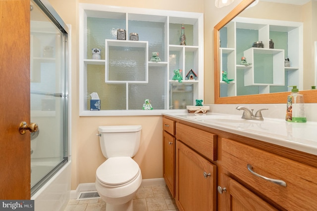 bathroom featuring tile patterned flooring, toilet, visible vents, vanity, and combined bath / shower with glass door