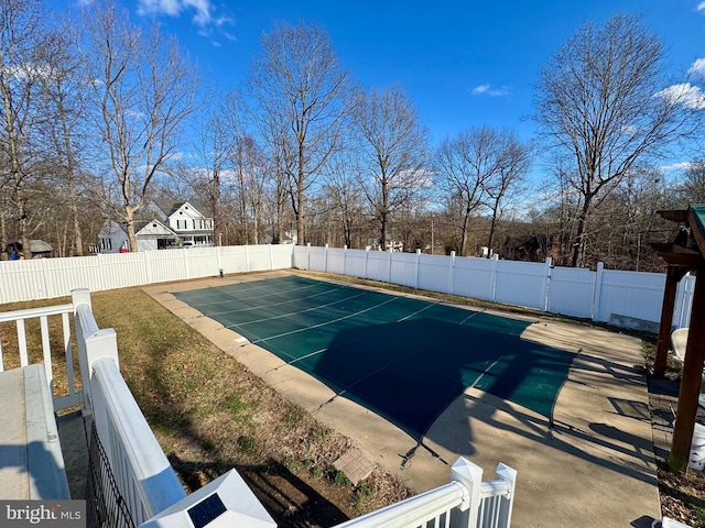 view of swimming pool with a fenced backyard and a fenced in pool