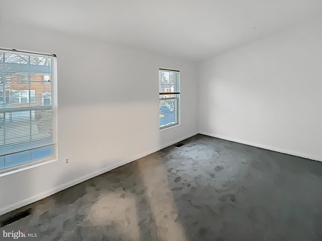 empty room with baseboards