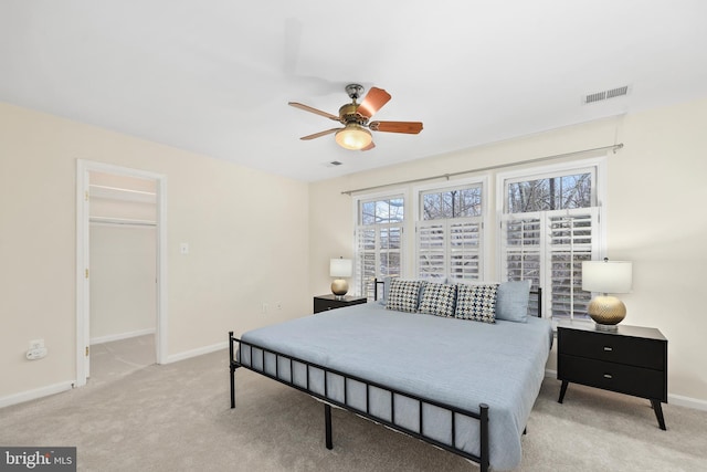 bedroom with baseboards, visible vents, and carpet floors