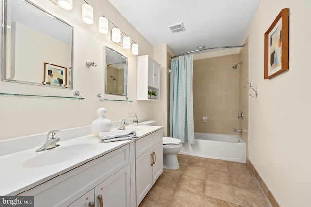 full bath featuring double vanity, visible vents, toilet, and a sink