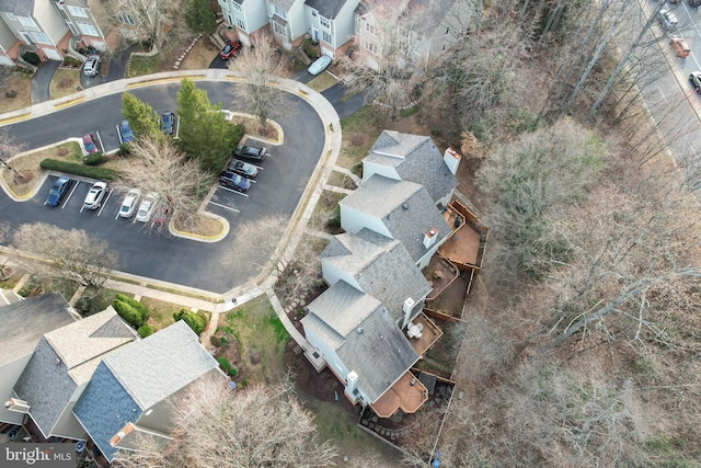 birds eye view of property with a residential view