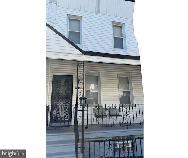 doorway to property with a porch