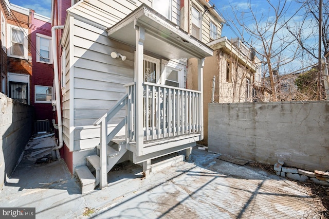 doorway to property with fence