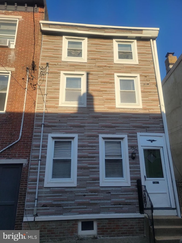 view of front of property featuring stone siding