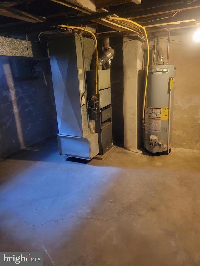 unfinished basement featuring water heater