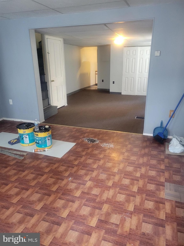 empty room with baseboards and visible vents