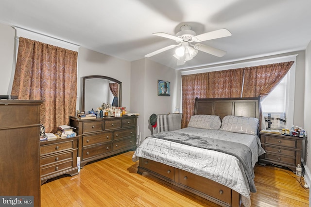 bedroom featuring ceiling fan and wood finished floors