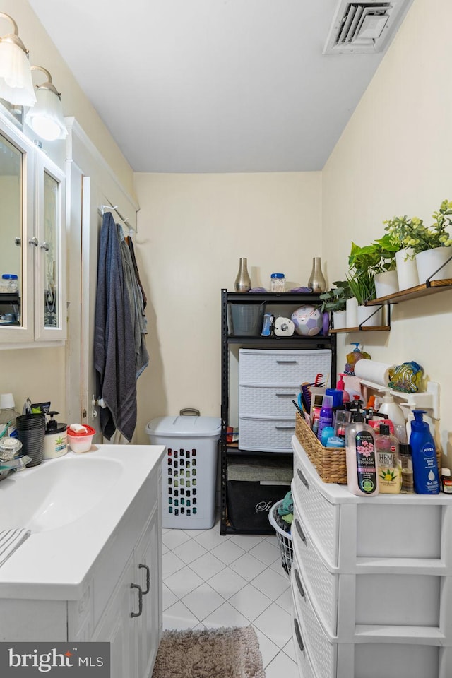 bathroom featuring tile patterned floors, visible vents, and vanity