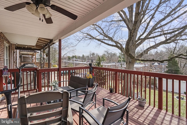 wooden terrace with a ceiling fan