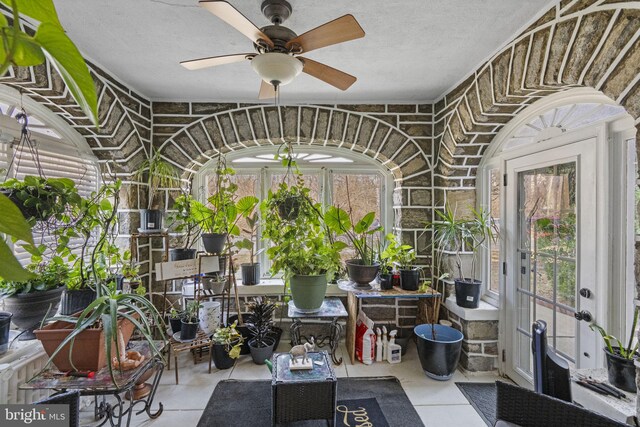 sunroom / solarium with ceiling fan