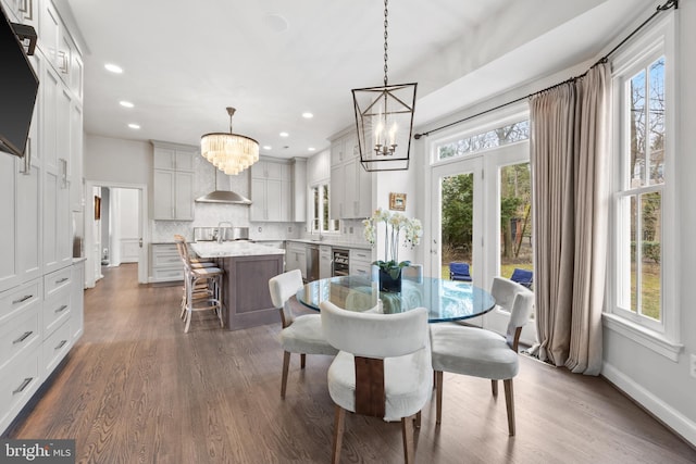 dining area with beverage cooler, baseboards, an inviting chandelier, recessed lighting, and dark wood-type flooring