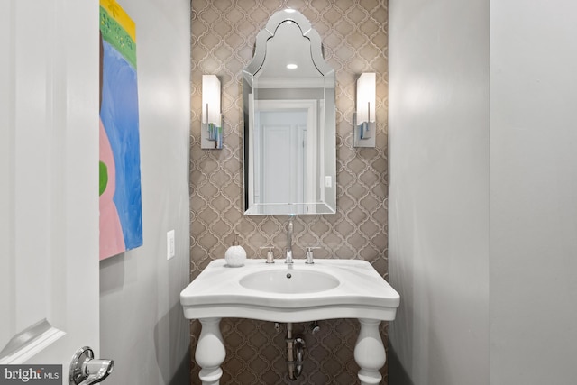 bathroom featuring wallpapered walls