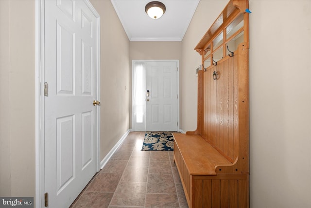 mudroom featuring baseboards, ornamental molding, and tile patterned floors