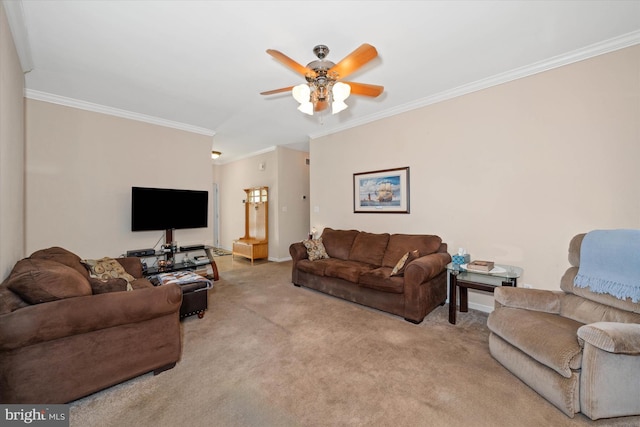 living area featuring ornamental molding, light carpet, ceiling fan, and baseboards