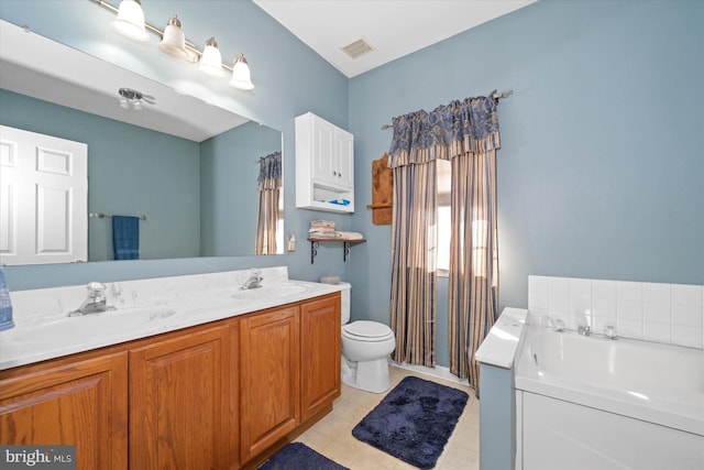 full bathroom featuring a bath, double vanity, a sink, and visible vents