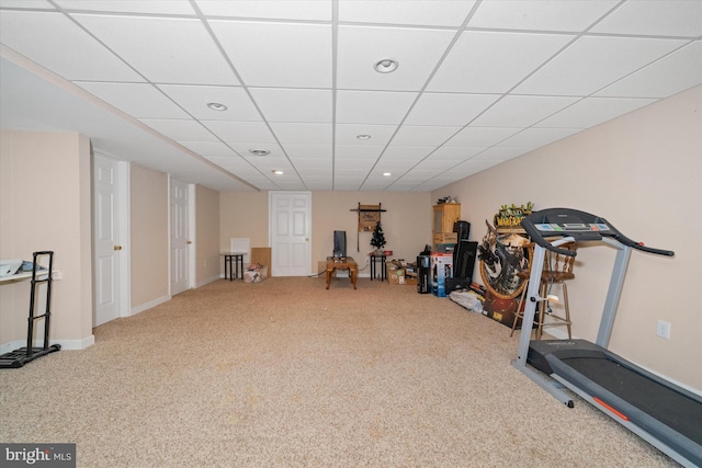 workout area with carpet, a paneled ceiling, and recessed lighting