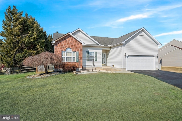 ranch-style home with roof with shingles, brick siding, a front yard, fence, and driveway