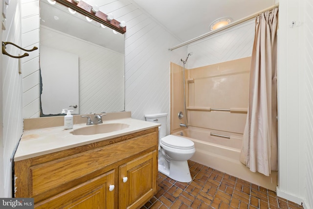 bathroom with vanity, shower / bath combination with curtain, toilet, and brick floor