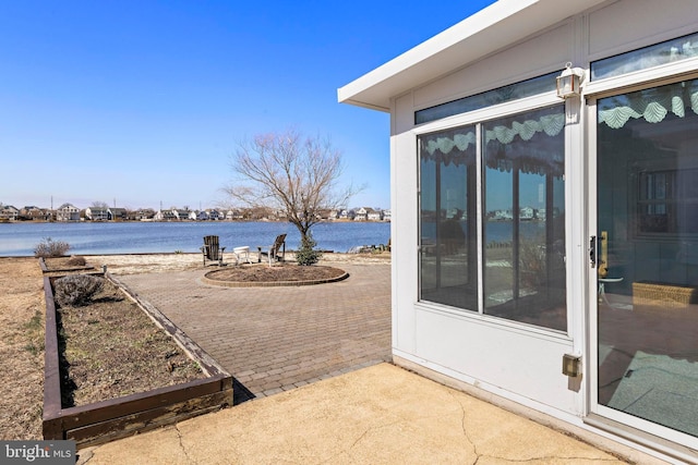 view of patio / terrace featuring a water view