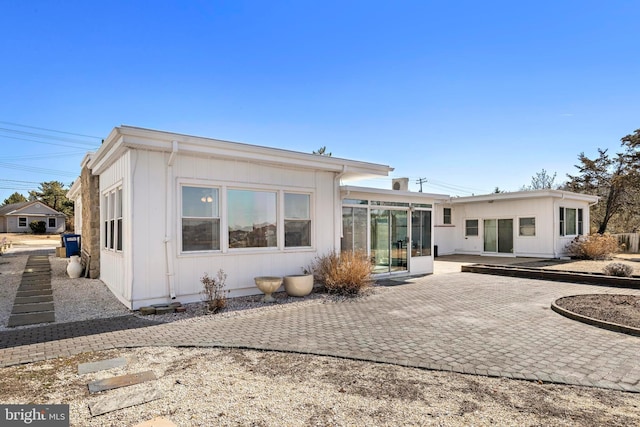 rear view of house featuring a patio