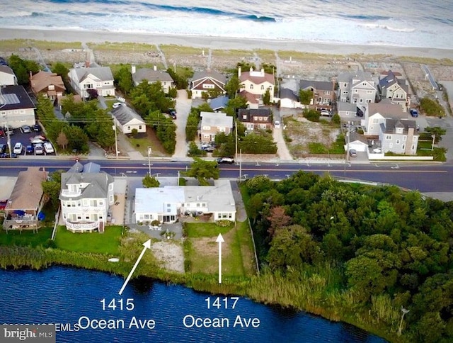 aerial view featuring a residential view and a water view