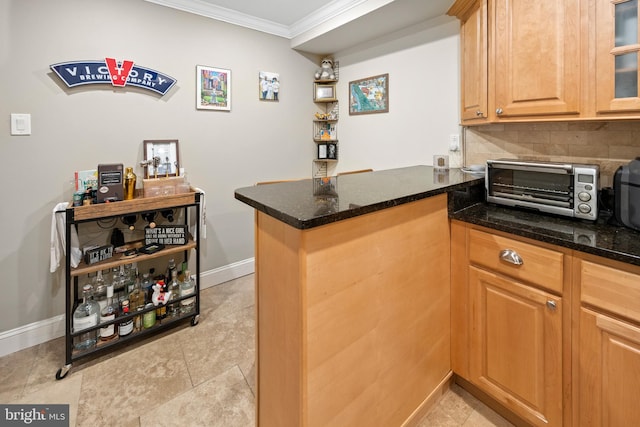 bar with decorative backsplash, baseboards, crown molding, and a toaster