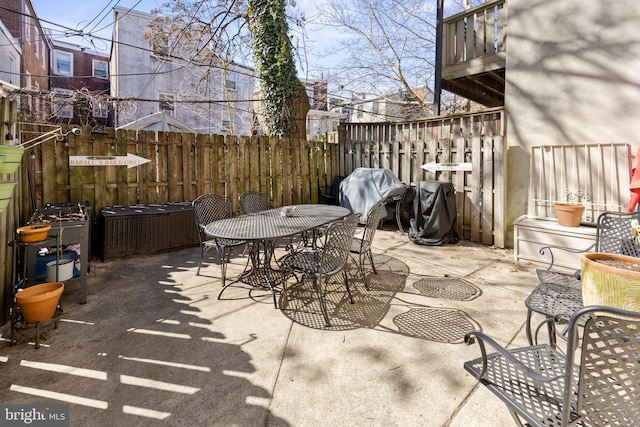 view of patio / terrace featuring outdoor dining area and fence