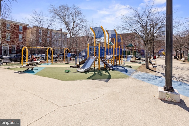 communal playground featuring fence