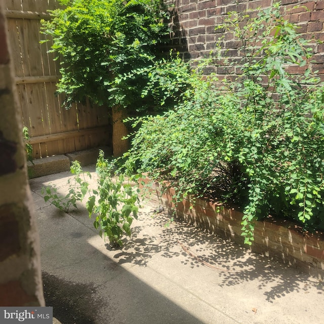 view of yard with a patio and fence