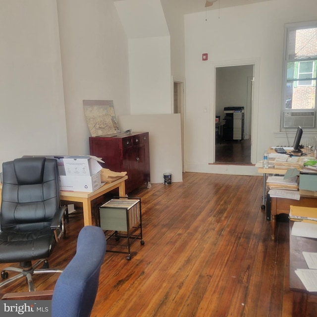 home office featuring cooling unit and hardwood / wood-style floors