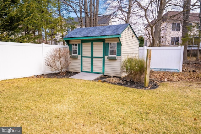 view of shed featuring a fenced backyard