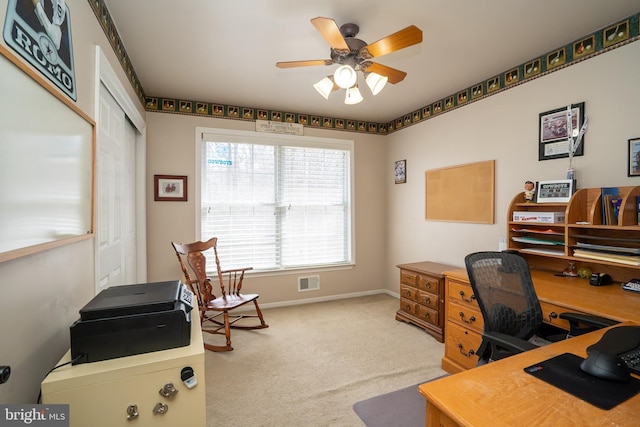 home office with baseboards, visible vents, carpet floors, and ceiling fan