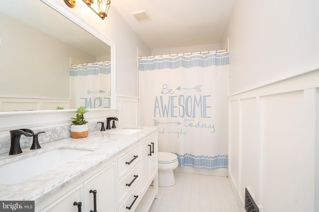 full bath featuring toilet, visible vents, and a sink